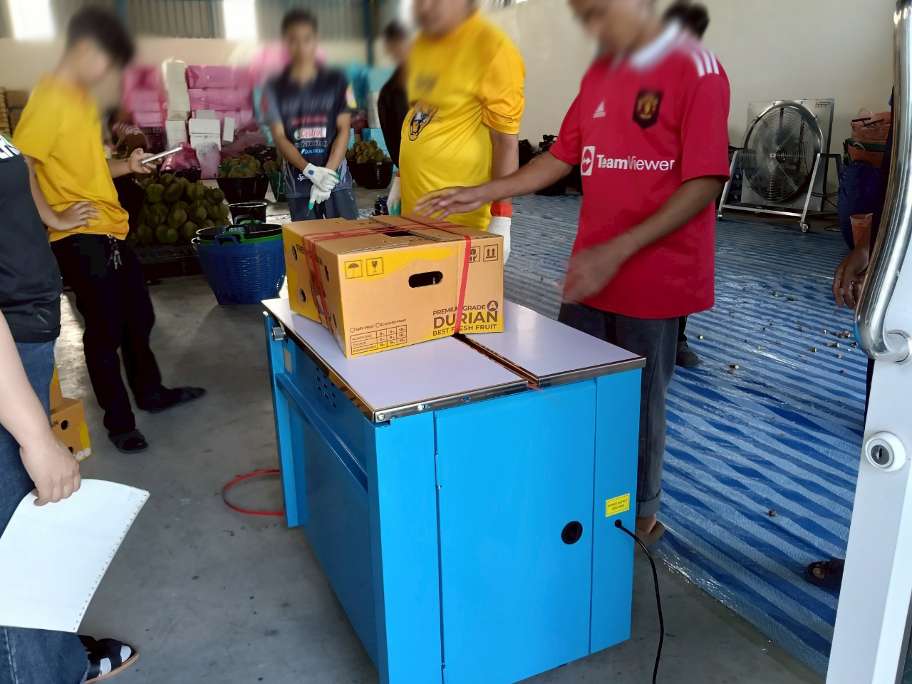จัดส่งเครื่องรัดกล่อง รุ่น WE-801H บริษัทส่งออกทุเรียน ตลาดไท